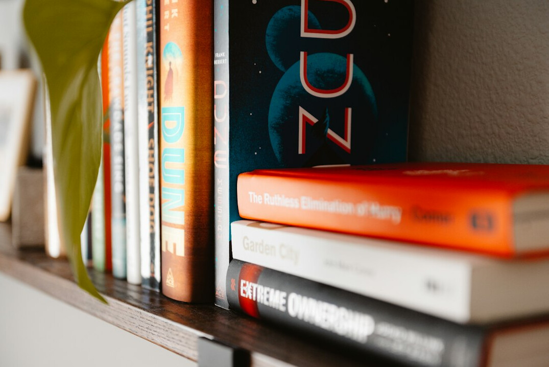 Colorful books stacked on a shelf