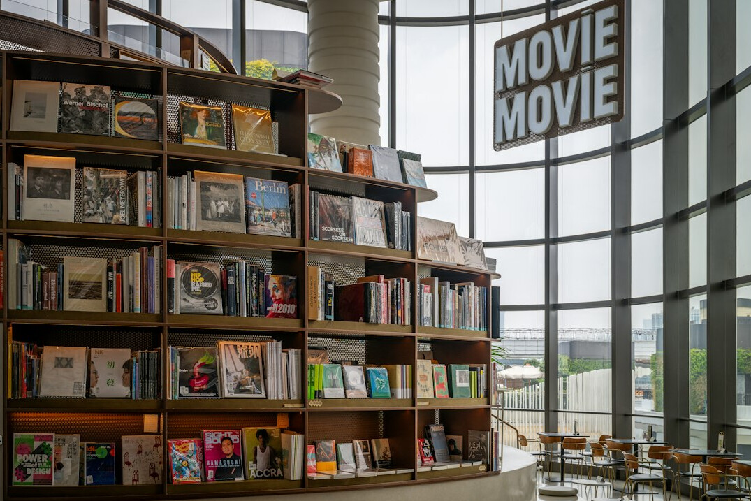 Open book on a table by a window