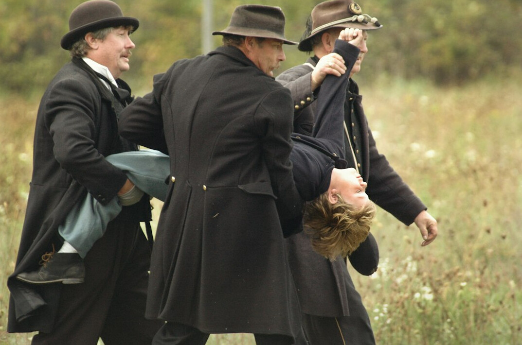 detective apprehending suspect