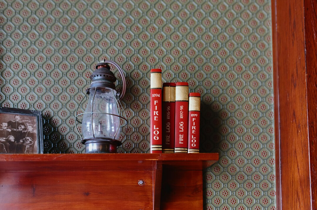 Old leather-bound books on a shelf
